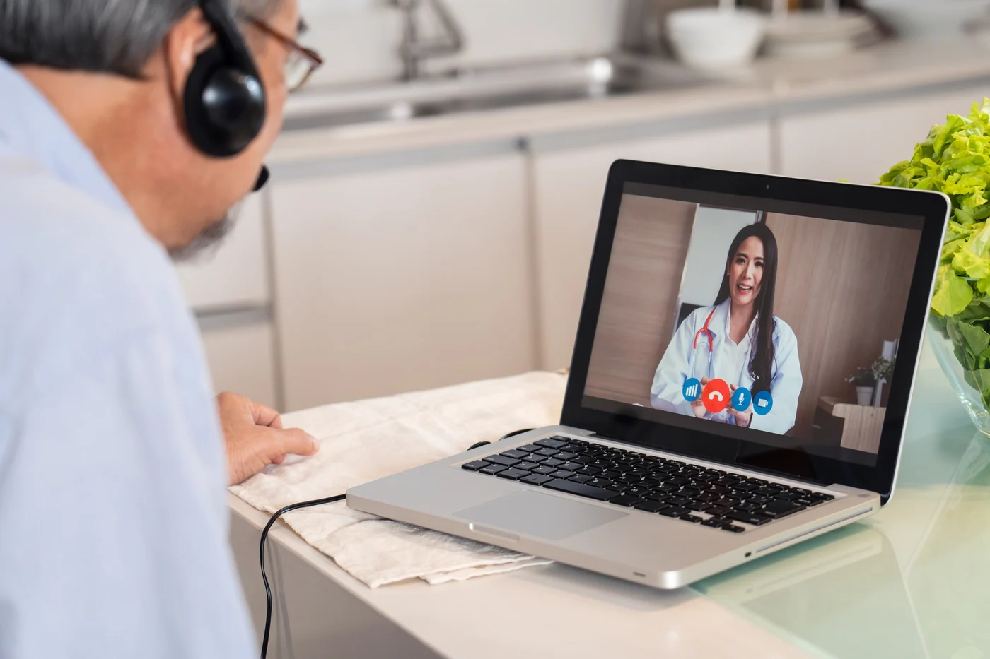 Senior patient on a video call with their doctor